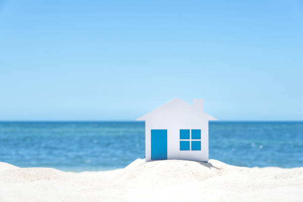 istock Small House On The White Sandy Beach 944957842