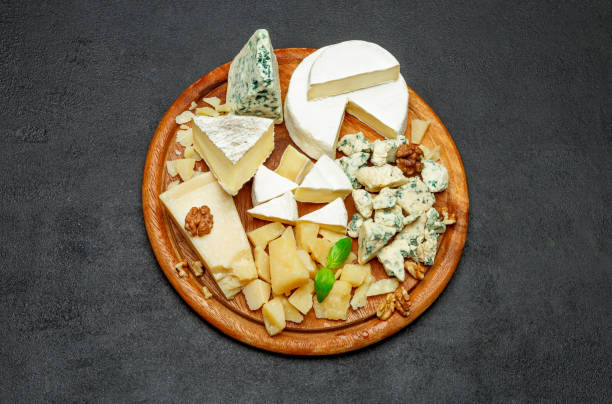 istock Cheese plate with Assorted cheeses Camembert, Brie, Parmesan blue cheese, goat 944962026