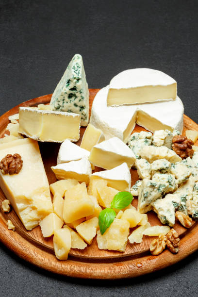 istock Cheese plate with Assorted cheeses Camembert, Brie, Parmesan blue cheese, goat 944962132