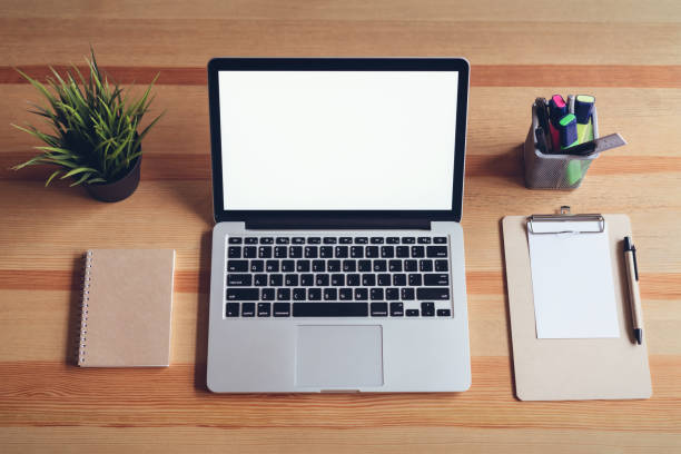 istock Laptop on table in office room background, for graphics display montage. Take your screen to put on advertising. 944962188