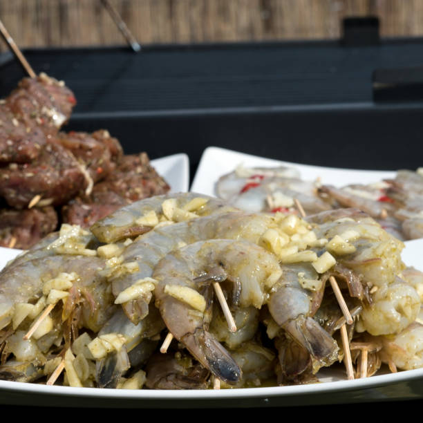 istock Prawns, meat and vegetables prepared for barbecue 944964976