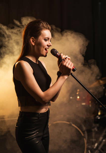 istock Female rock singer on stage 944965130