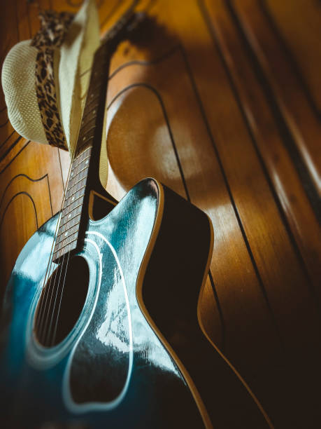 istock Acoustic guitar with lady's hat. 944965698