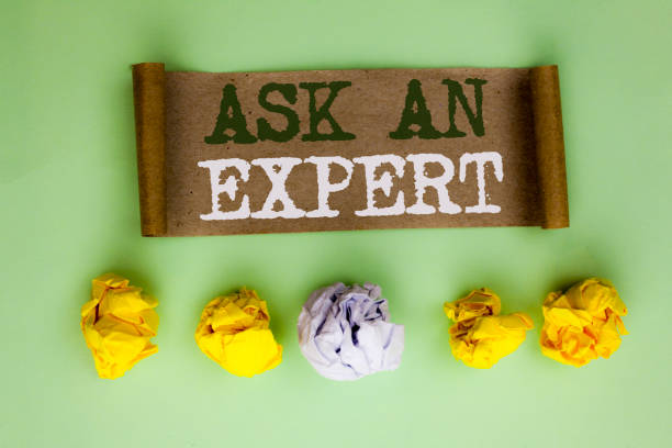 istock Handwriting text Ask An Expert. Concept meaning Consult a Professional Asking for Advice Make a Question written on Cardboard Paper on the plain background Paper Balls next to it. 944968850