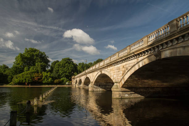 istock View of a bridge across a lake on a sunny day 944969112