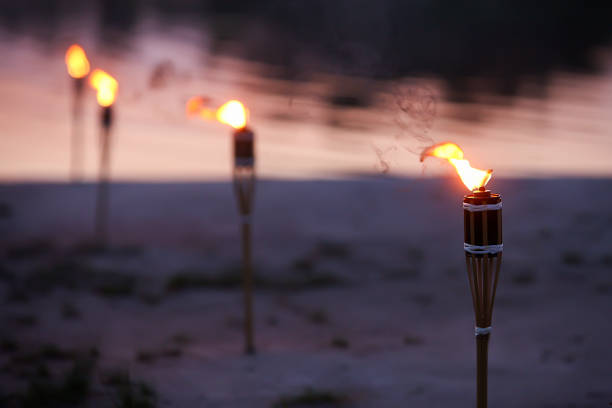 istock Traditional wooden torch flame at night 944970048