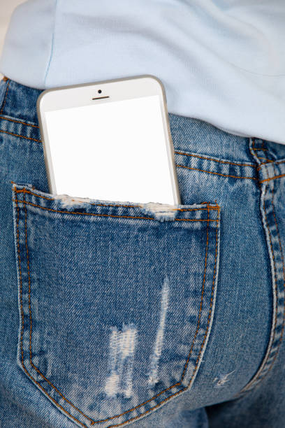 istock Close up of Smartphone with blank screen in jeans pocket. 944974672