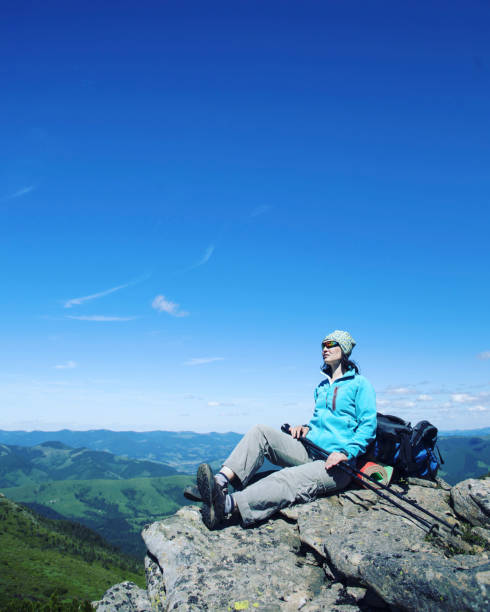 istock Summer hike in the mountains with a backpack and tent. 944975332