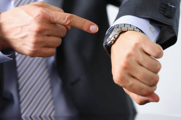 istock Man in suit and tie check out time 944975988