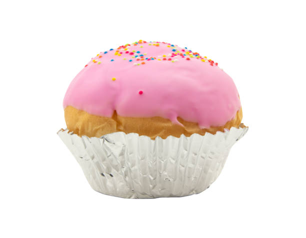 istock pink chocolate coated bun cupcake isolated on white background 944976210