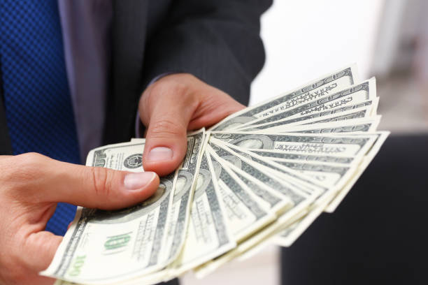 istock Man in suit and tie hold in arm pack of 944979806