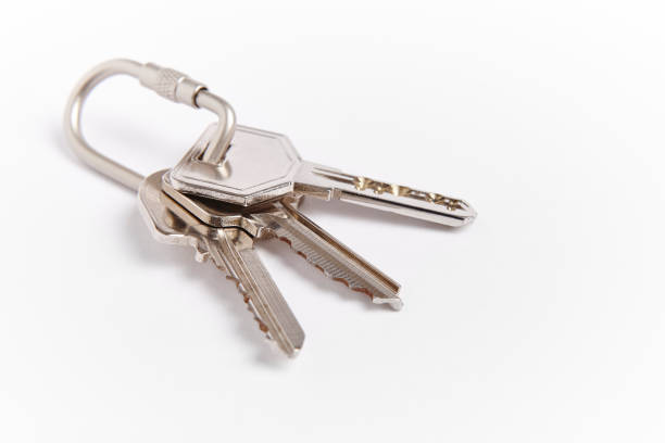 istock Key ring with keys over white background. Rent 944982900