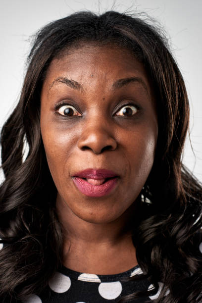istock Studio portrait of African woman making a silly fun expression 944983860