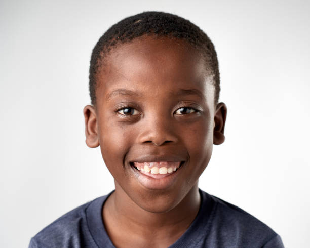istock Studio portrait of young African boy child smiling 944986212