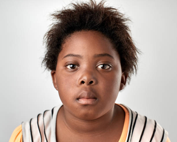 istock Studio portrait of young African girl with serious expression 944986462