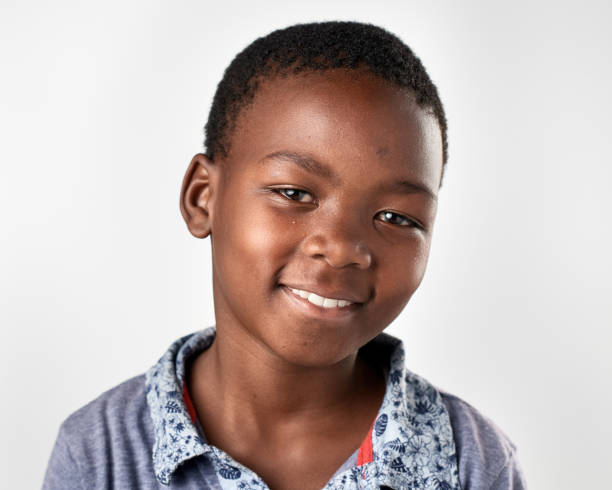 istock Studio portrait of African boy smiling 944986774