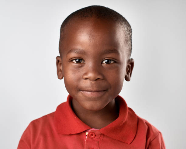 istock Studio portrait of cute African boy smiling 944986812
