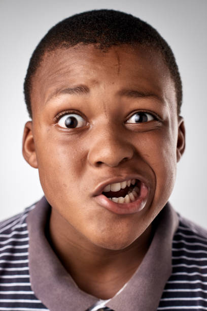 istock Studio portrait of young African boy pulling a funny expression 944987212