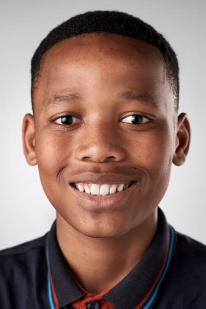 istock Studio portrait of young African boy smiling 944987364