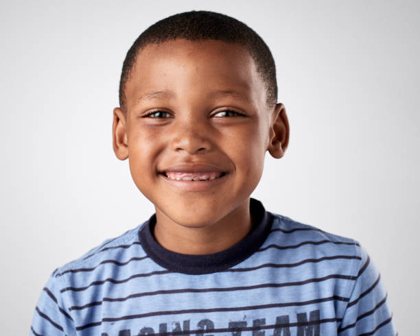istock Studio portrait of young African boy child smiling 944987516