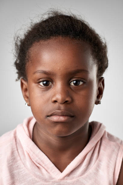 istock Studio portrait of black girl with serious expression 944987758