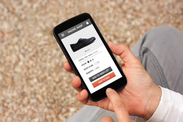 istock Hands holding smart phone with online shop concept on screen 944987872
