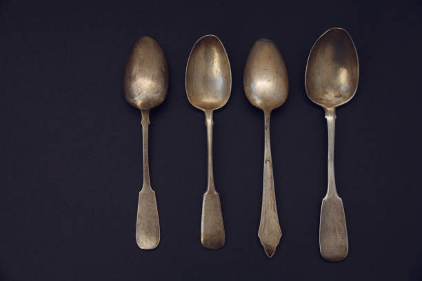 istock set of antique silver spoons on a dark background 944991216