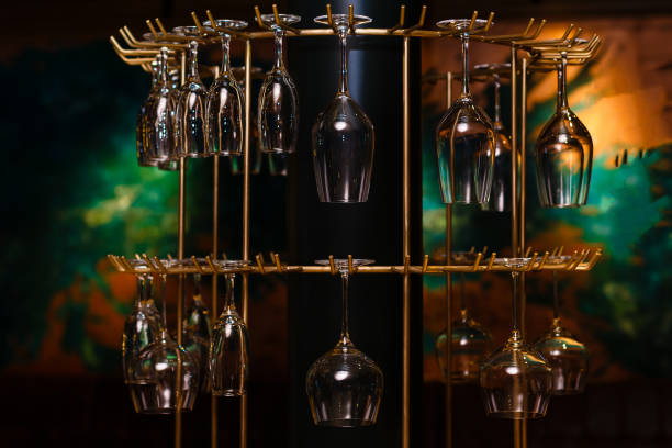 istock Empty glasses for wine above a bar rack in vintage tone. 944991378