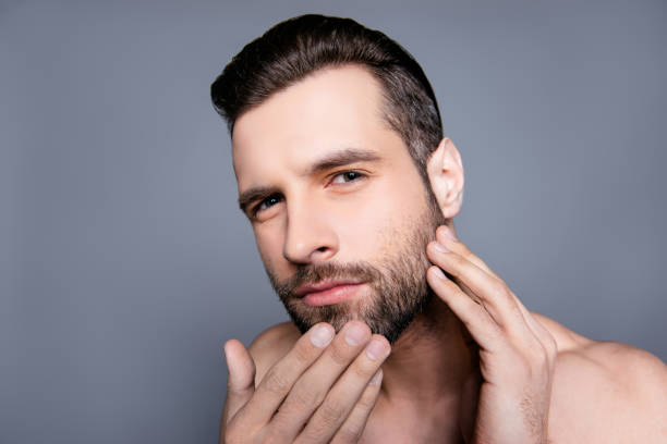 istock Young attractive man expertising his skin before shaving 944991526