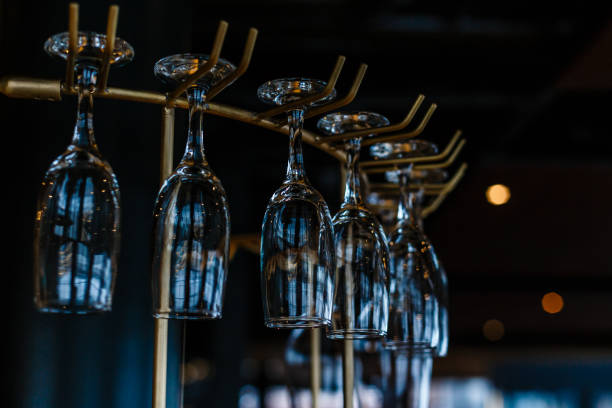 istock glasses hanging over the bar. Soft focus 944991918