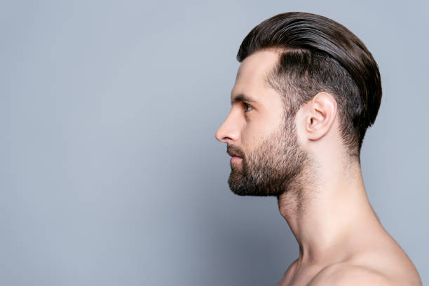 istock Side view of handsome young bearded man after bath 944995688