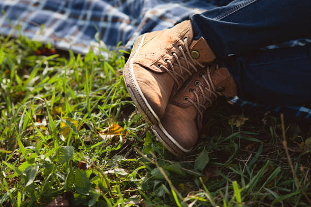 istock legs in yellow leather boots 944996388