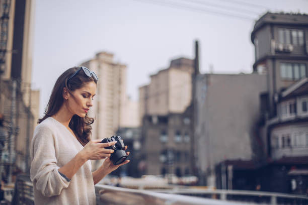 istock Girl photographer downtown 944997052