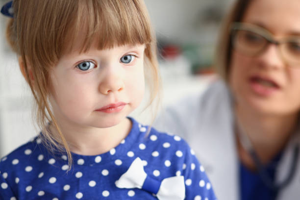istock Little child with mother at pediatrician reception 944997334