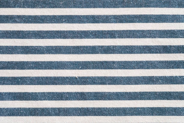 istock Closeup surface of white and blue fabric bag textured background 945001882