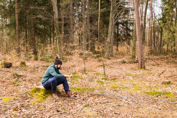istock man taking photo with smartphone in the forest 945005066