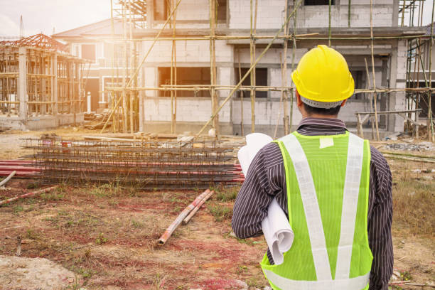 istock Asian business man construction engineer worker at house building site 945007722