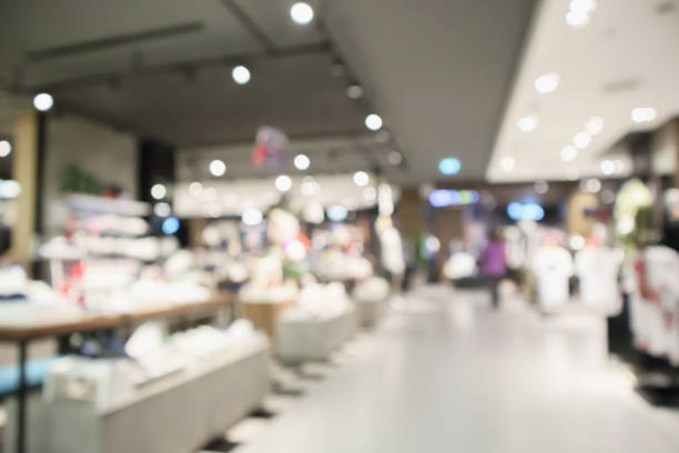 istock Abstract blur clothing boutique display interior of shopping mall background 945007798