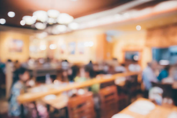 istock Restaurant cafe or coffee shop interior with people abstract defocused blur background 945007918