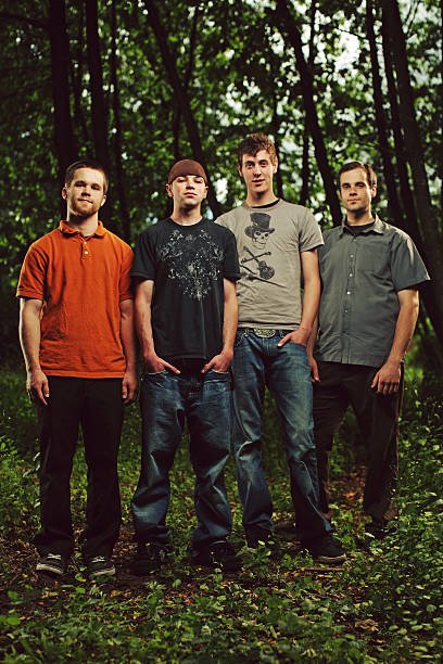 istock Four Teenage Males Standing in a Forest 94500903