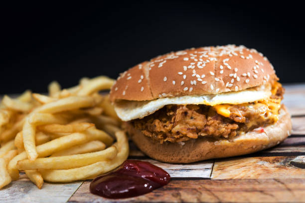 istock Cheese burger - American cheese chicken burger with fresh salad 945012570