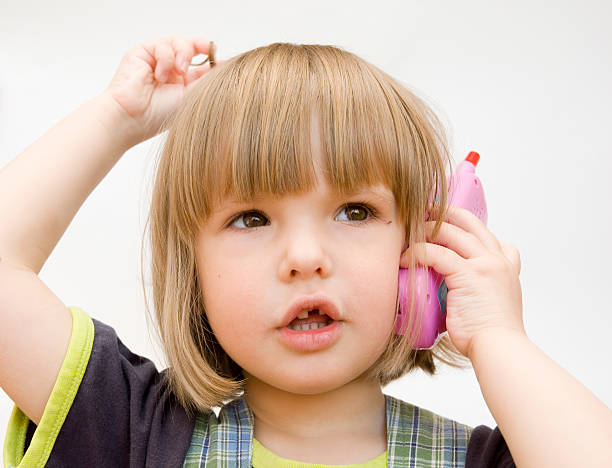 istock child with a toy telephone 94501327