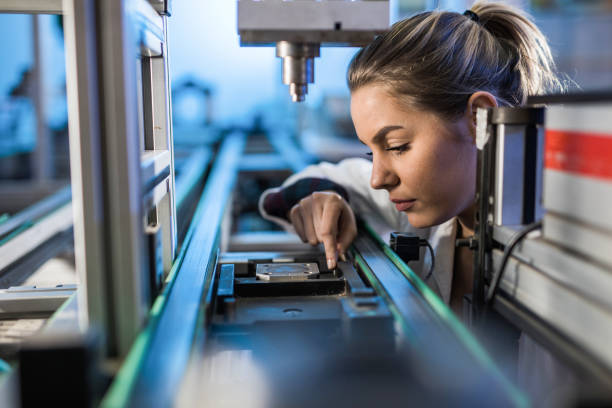 istock Female engineer examining machine part on a production line. 945022490