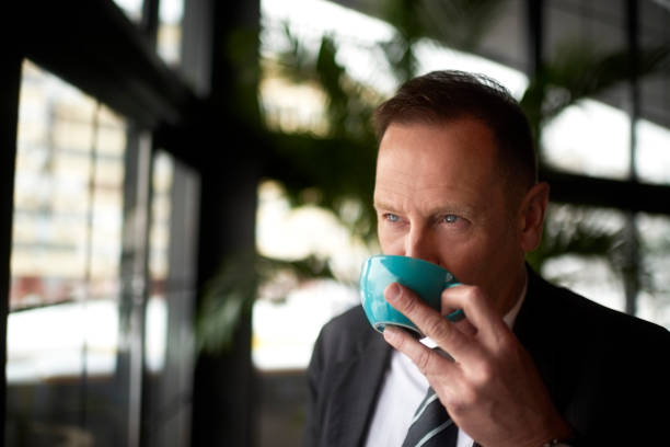 istock Businessman in coffee shop 945022898