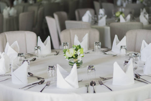 istock Table setting for dining room, the table is decorated with flowers 945023528