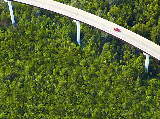 Aerial View of overpass with red car  overpass road stock pictures, royalty-free photos & images