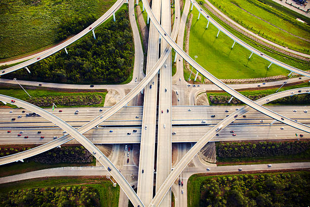 aerial view of traffic and overpasses - vervoer stockfoto's en -beelden