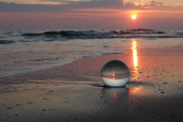 istock Sunset at the beach with the crystal ball 945032066