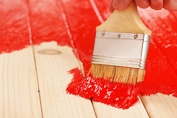 istock Covering wooden surface with a red paint 94503215