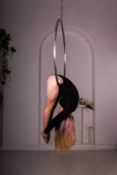 istock Girl training on aerial ring 945032326